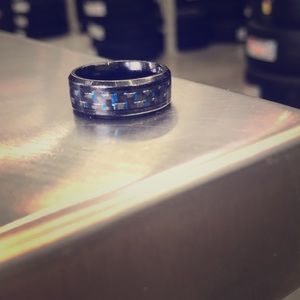 Black ring with blue highlight.